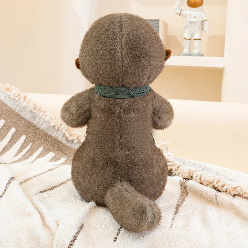 Peluche loutre avec écharpe