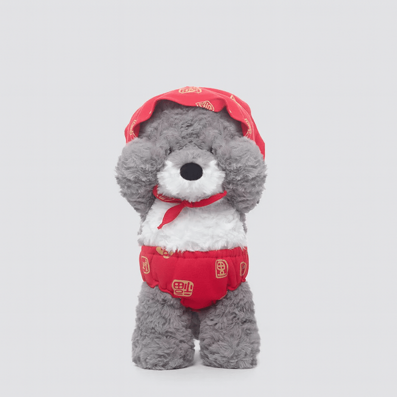 La peluche loup du petit chaperon rouge se cachant les yeux sur fond blanc