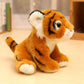 Peluche bébé tigre orange assis sur une table