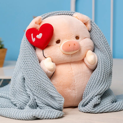 Peluche cochon amoureux caché sur une couverture