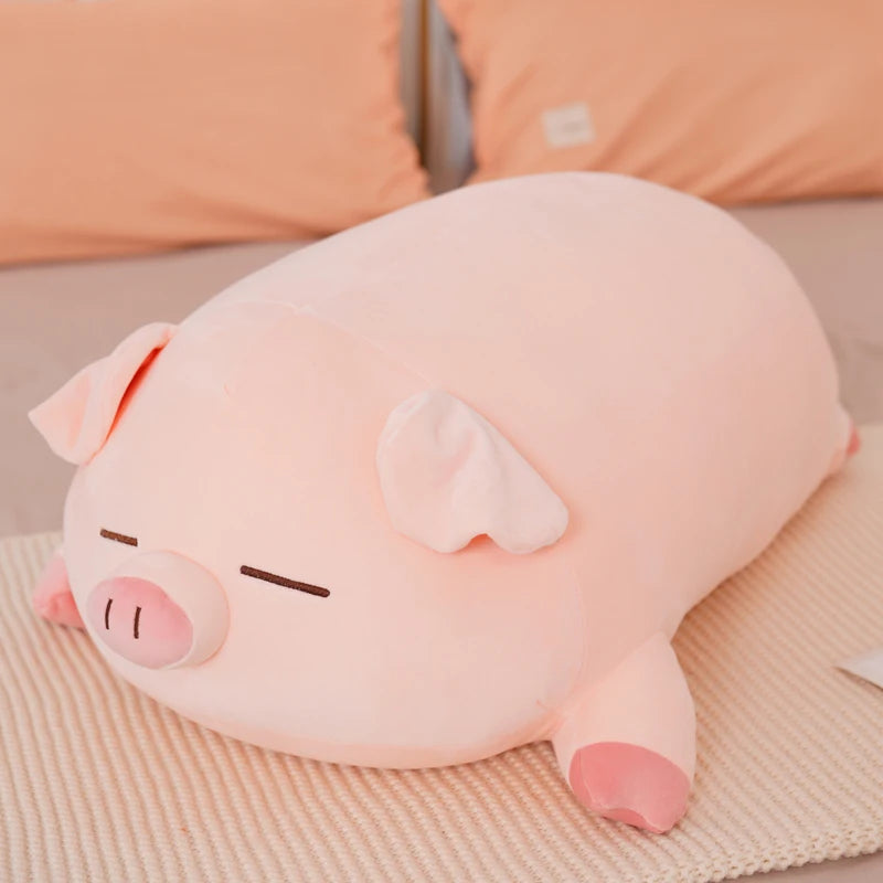 Peluche cochon en coussin endormi