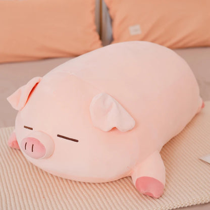Peluche cochon en coussin endormi