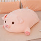 Peluche cochon en coussin intéréssé