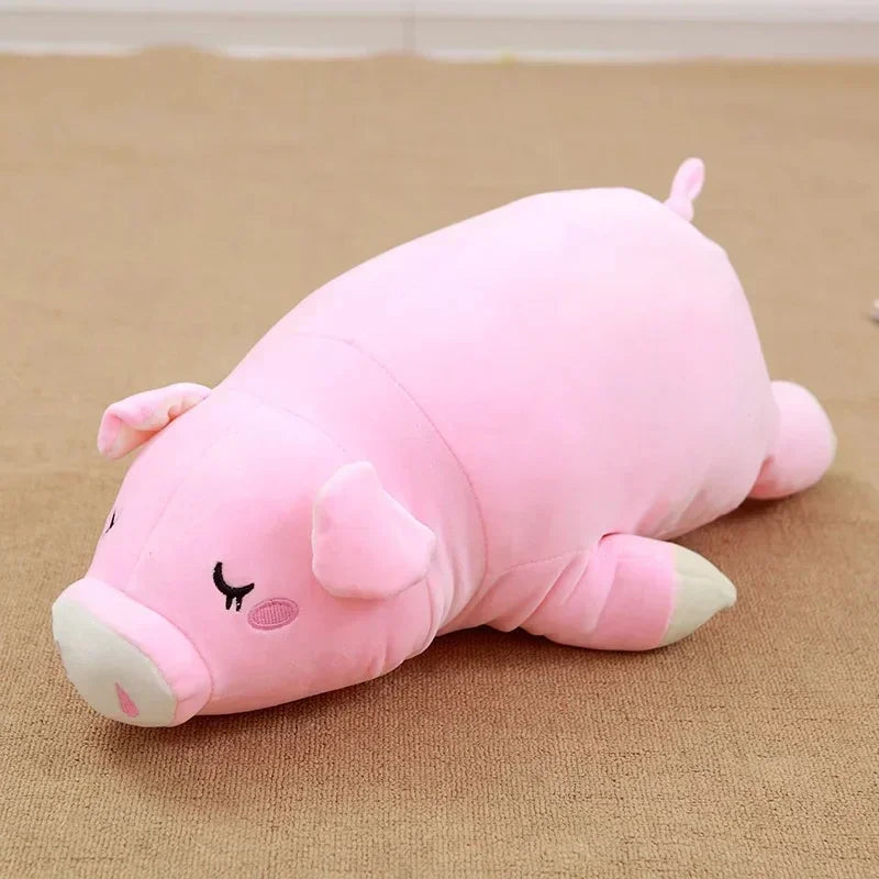 Peluche cochon endormi sur de la moquette