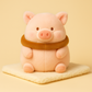 Peluche cochon toast sur une couverture