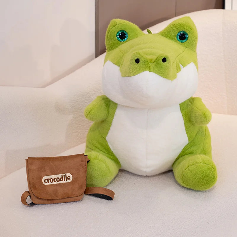 Peluche crocodile vert écolier avec son sac à dos à coter de lui