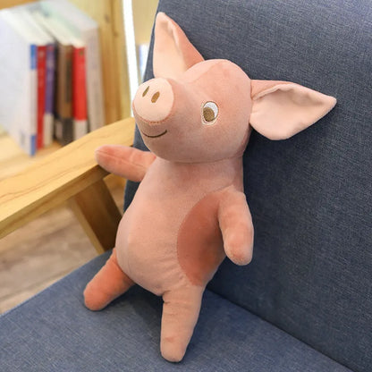Peluche des petits cochons rose sur un fauteuil
