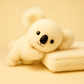 Peluche koala grande famille sur couverture