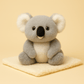 Peluche koala kawaii sur couverture