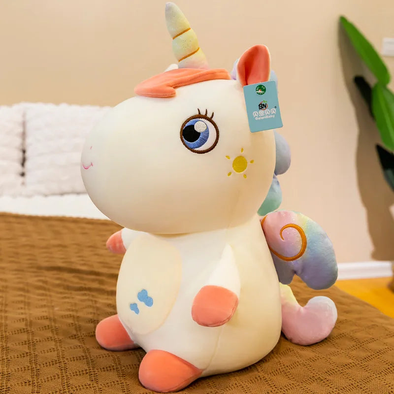 Peluche licorne assise