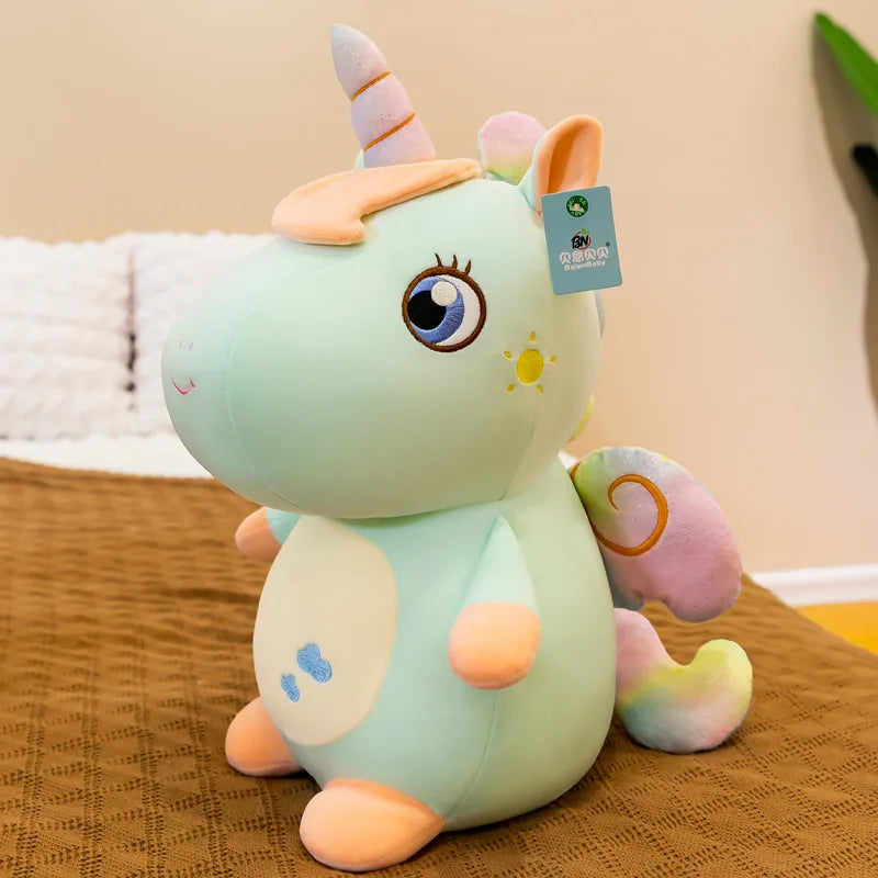 Peluche licorne assise