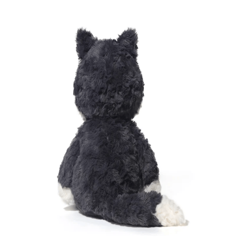 Peluche loup gris foncé assis de dos sur fond blanc