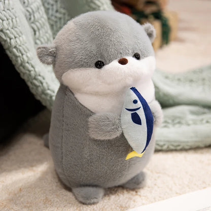 Peluche loutre avec son poisson
