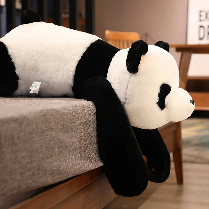 Peluche panda xxl sur canape