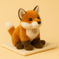 Peluche renard domestique sur couverture