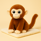 Peluche singe aux gros yeux sur couverture