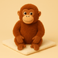 Peluche singe orang-outan sur couverture