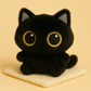 Petit chat noir en peluche