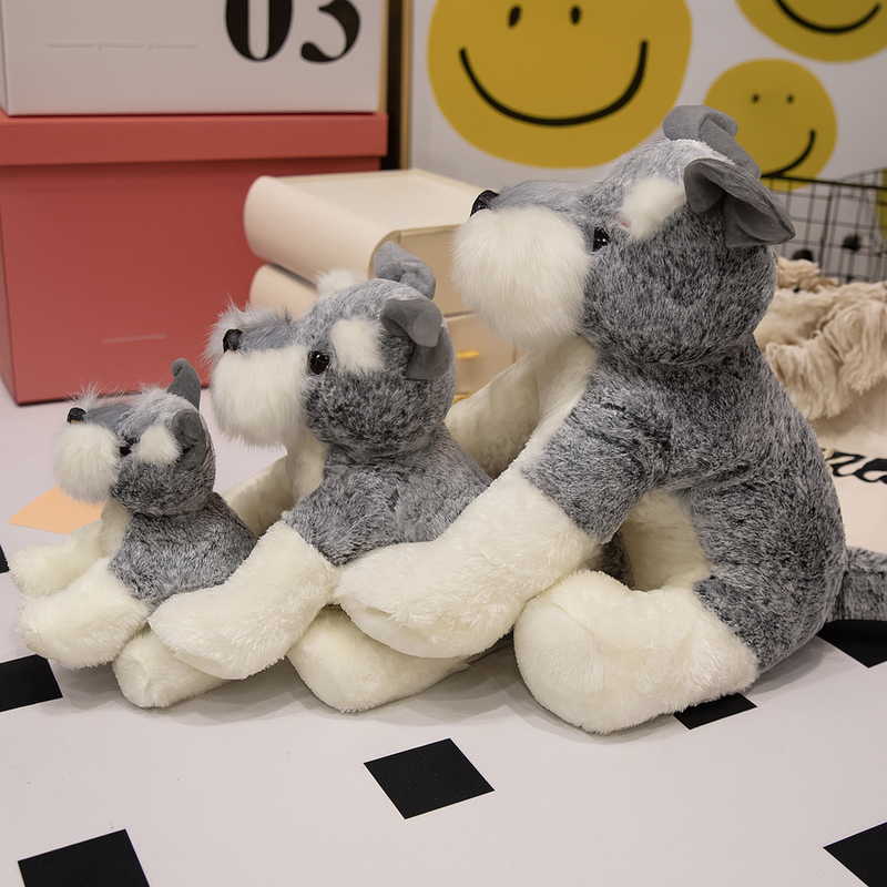 Trois peluches chiens Schnauzer sur le sol