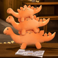 Peluche stégosaure orange