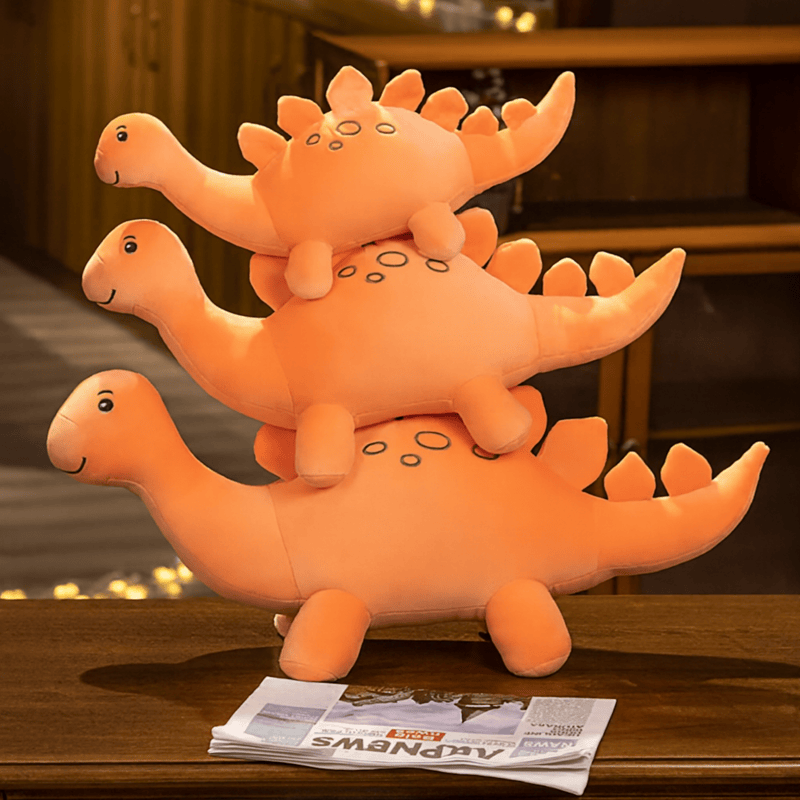 Peluche stégosaure orange